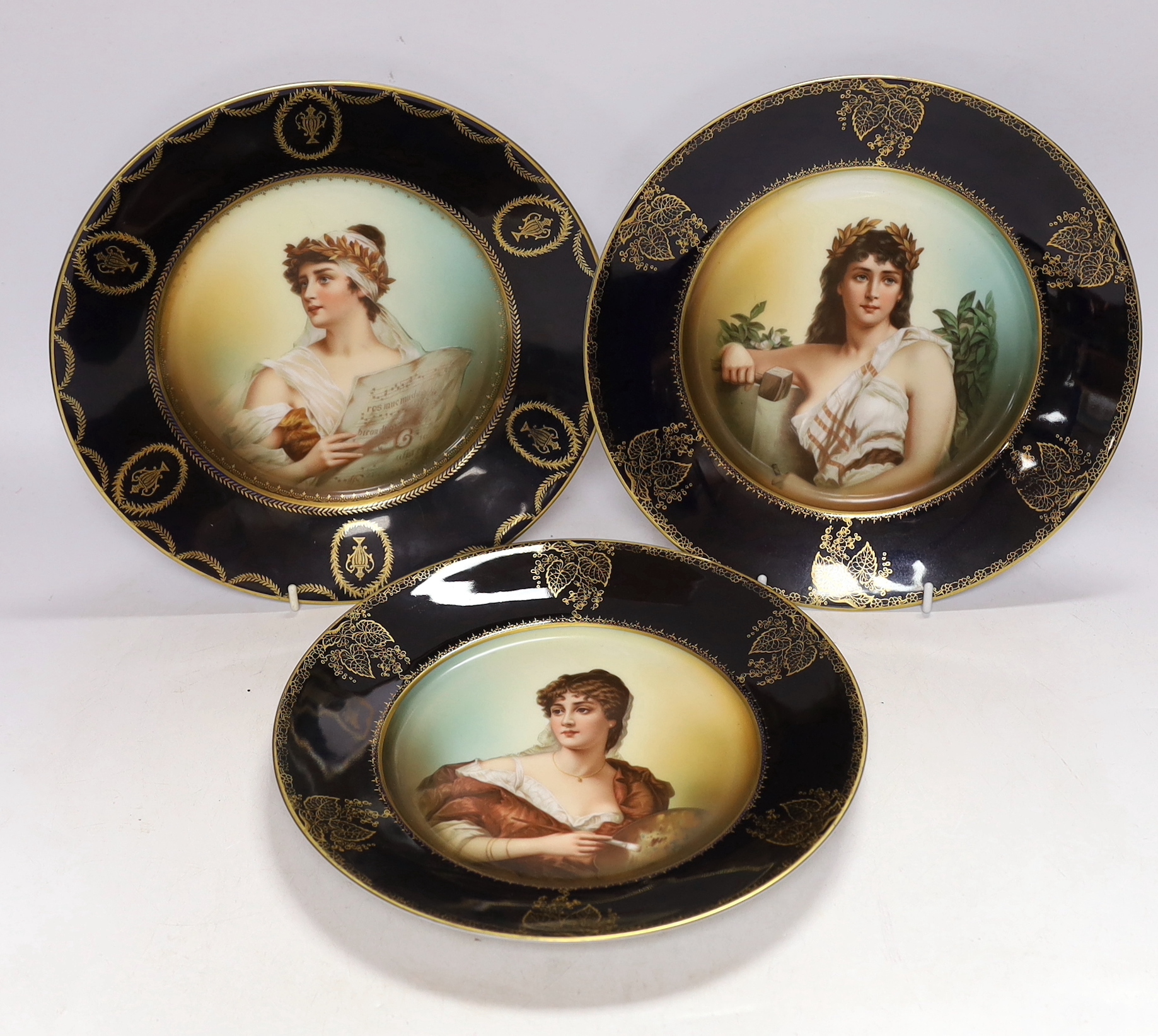 A set of three Rosenthal porcelain cabinet plates, decorated with classical females emblematic of the arts and music, 25.5cm